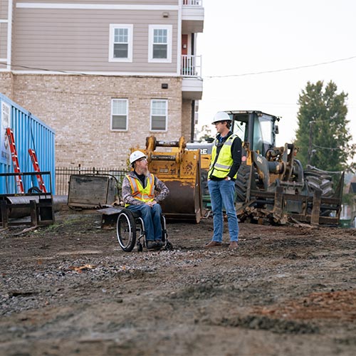 man in wheelchair on job site
